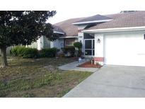 Single-story house with a two-car garage and a well-maintained lawn at 5243 Sagamore Ct, New Port Richey, FL 34655
