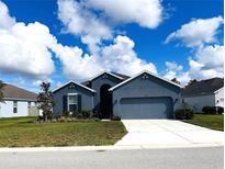 Curb appeal abounds in this charming new construction home! at 13447 Newport Shores Dr, Hudson, FL 34669