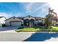 One-story home with a two-car garage and landscaped yard at 12528 Roseland Dr, New Port Richey, FL 34654