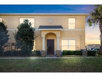 Charming two-story home featuring a well-maintained front yard and classic architectural details at 6334 Timberly Ln, Zephyrhills, FL 33542