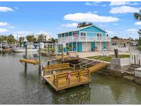 Charming waterfront home with private dock and boat lift at 13822 Judy Ave, Hudson, FL 34667