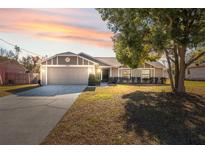 Nice curb appeal! Single-story home with a two-car garage and a well-maintained lawn at 3264 Landover Blvd, Spring Hill, FL 34609