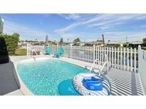 Inviting refreshing pool with a floating raft, perfect for relaxation at 5102 Blue Heron Dr, New Port Richey, FL 34652