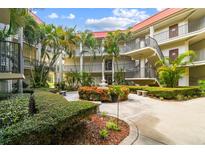Lovely condo community courtyard with fountain and landscaping at 2700 Bayshore Blvd # 3108, Dunedin, FL 34698