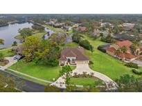 Stunning property with a lake view and spacious lot at 4412 Lake In The Woods Dr, Spring Hill, FL 34607