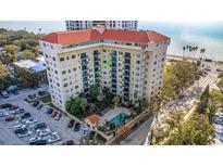 Aerial view of a waterfront building with pool and parking at 2109 Bayshore Blvd # 609, Tampa, FL 33606