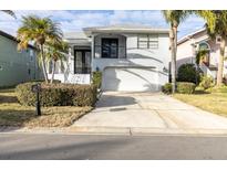Beautiful home with 2-car garage, lush landscaping, and a charming curb appeal at 5925 Seaside Dr, New Port Richey, FL 34652