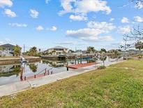 Private dock with steps leading to the canal at 4225 Carlos Ct, Hernando Beach, FL 34607