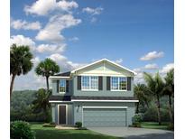 Two-story house with a two-car garage and palm trees at 8917 Waxwing Way, Parrish, FL 34219