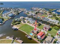 Wide aerial showcasing waterfront property location and neighborhood at 6528 Louise Ct, Hudson, FL 34667