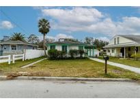Charming single-story home with green trim and well-maintained lawn at 5648 Riverview Dr, New Port Richey, FL 34652