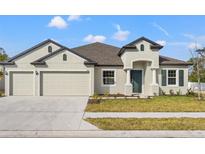 Charming single-Gathering home with a two-car garage and well-maintained lawn at 14421 Nonna Sky Drive Dr, Spring Hill, FL 34609