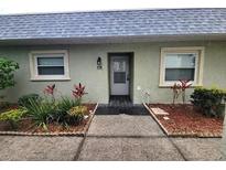 Inviting front entrance with well maintained landscaping and neutral color scheme at 3233 Teeside Dr, New Port Richey, FL 34655