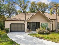 Charming single-story home with a well-manicured lawn and inviting curb appeal at 6785 Poinciana Ct, Spring Hill, FL 34606