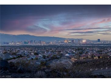 Panoramic city view of Las Vegas skyline at sunset, showcasing the vibrant cityscape and distant mountains at 348 Unicorn Hills Dr, Henderson, NV 89012