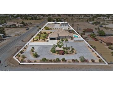 Aerial view of house, pool, and expansive lot at 2851 S Winchester Ave, Pahrump, NV 89048