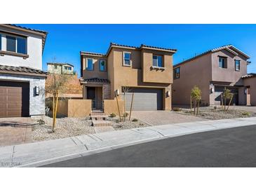 Two-story house with gray garage door and landscaping at 106 Via Franello, Henderson, NV 89011