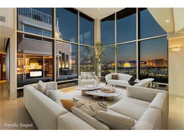 Bright living room with floor-to-ceiling windows and city views, offering a stylish and modern design at 3111 Bel Air Dr # 28C, Las Vegas, NV 89109