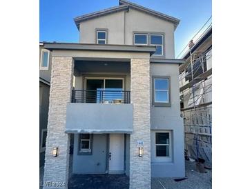 Two-story home with stone accents and balcony at 1441 Nocturnal Flight St, Las Vegas, NV 89138