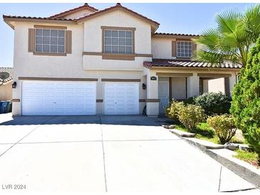 Two-story house with a two-car garage and landscaped front yard at 7917 Sally Irene Ct, Las Vegas, NV 89113