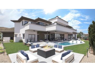 Luxury backyard featuring a modern fire pit, a sparkling pool, and elegant lounge seating at 12 Oakmont Hills Ln, Las Vegas, NV 89141