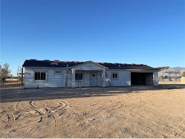 Newly constructed single-story home with attached garage at 1280 Carson, Pahrump, NV 89048