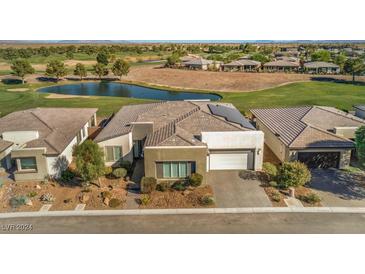 Single-story home with desert landscaping, golf course, and pond views at 4775 E Beacon Ridge Dr, Pahrump, NV 89061