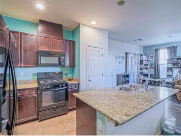 Modern kitchen with granite countertops and stainless steel appliances at 4590 Lime Straight Dr, Las Vegas, NV 89115