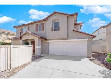 Two-story house with attached garage and a landscaped front yard at 10596 Corte Sierra St, Las Vegas, NV 89183