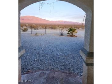 Unobstructed desert view framed by an arched doorway at 4780 Horizon Ave, Pahrump, NV 89060