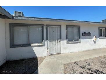 Charming single-story exterior showing the front door and two windows at 2516 E Mesquite Ave, Las Vegas, NV 89101