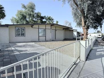 Charming single-story home with a well-maintained front yard and updated exterior paint at 2509 Canosa Ave, Las Vegas, NV 89104