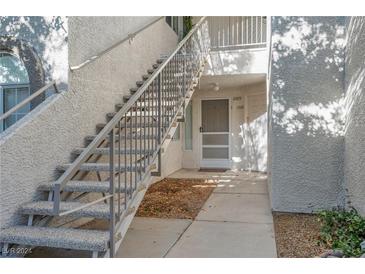 Exterior view showing stairs and entrance to condo at 3125 N Buffalo Dr # 1089, Las Vegas, NV 89128