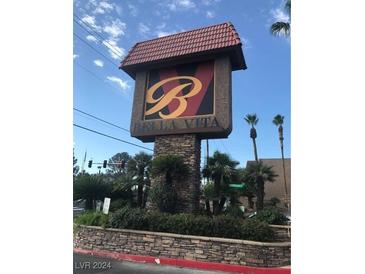 Decorative community sign featuring a stone base and an ornate letter B logo at 5317 Indian River Dr # 295, Las Vegas, NV 89103