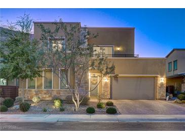 Stunning two-story home with modern facade and landscaped yard at 6411 Wild Blue Ct, Las Vegas, NV 89135