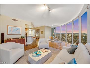 Bright living room with floor-to-ceiling windows showcasing city views, modern decor and open floor plan at 222 Karen Ave # 3307, Las Vegas, NV 89109
