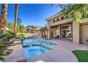 Inviting pool and spa with ample patio space at 525 Summer Mesa Dr, Las Vegas, NV 89144