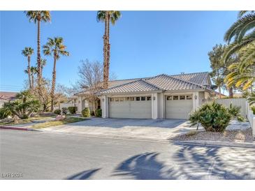 Single-story house with three-car garage, tile roof, and landscaping at 3767 Darren Thornton Way, Las Vegas, NV 89120