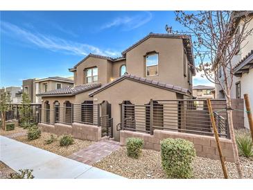 Two-story house with modern facade and landscaped front yard at 11712 Emerald Lake Ave, Las Vegas, NV 89138