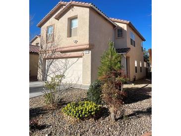 Charming two-story home featuring a two-car garage and low maintenance landscaping at 11177 Deluna St, Las Vegas, NV 89141