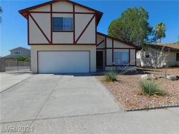 Two-story house with attached garage and landscaped front yard at 748 Morrocco Dr, Henderson, NV 89002