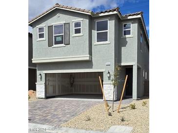 Charming two-story home with a two-car garage and neutral-toned exterior paint at 7116 Parkallen Ave, Las Vegas, NV 89113
