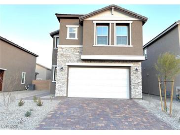 Two-story house with stone accents and a two-car garage at 5076 Dule Grove St, Las Vegas, NV 89130