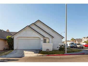 Single-story house with attached garage and landscaping at 2525 Kirkmichael Ln, Henderson, NV 89014