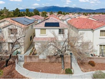 Charming two-story home with a well-maintained yard, solar panels, and traditional architectural details at 3023 Sunset Harbor Ct, North Las Vegas, NV 89031