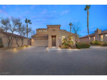 Stunning two-story home with stone accents and a welcoming front porch at 1282 Calcione Dr, Henderson, NV 89011