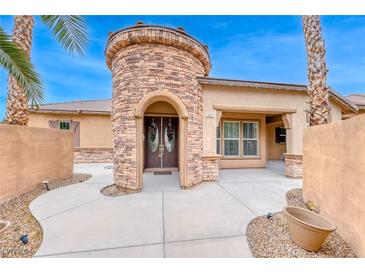 Inviting home exterior with stone accents and landscaped walkway at 5527 Breecher Ave, Las Vegas, NV 89131