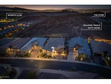 Serene community street view, showing well-maintained homes and scenic mountain backdrop at twilight at 11 Via Tavolara, Henderson, NV 89011