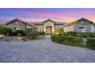 Stunning single-story home with stone accents and landscaped front yard at 4160 W Ford Ave, Las Vegas, NV 89139