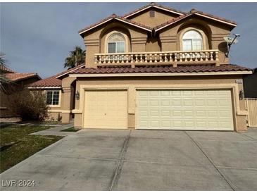 Two-story home features a three-car garage and a balcony at 4900 Quinlan Ave, Las Vegas, NV 89130